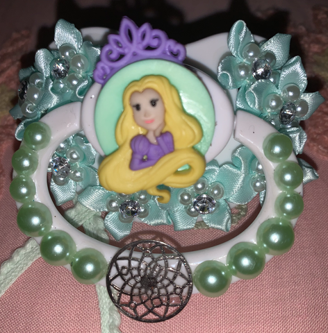 white adult pacifier with light blue pearls and light blue satin ribbon flowers and a Rapunzel pin
